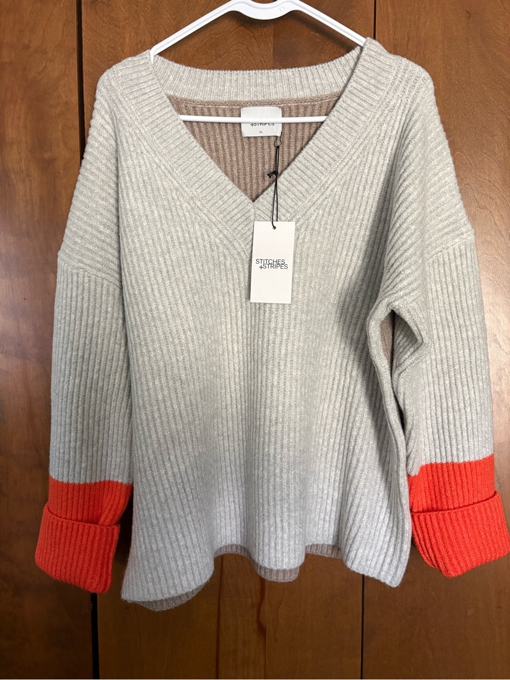 Stitches and Stripes V-Neck Ribbed Sweater with Orange Cuffs